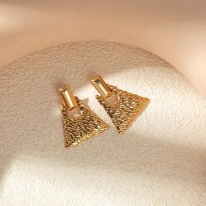Elegant gold hollow trapezoid earrings with wavy texture for luxury party wear