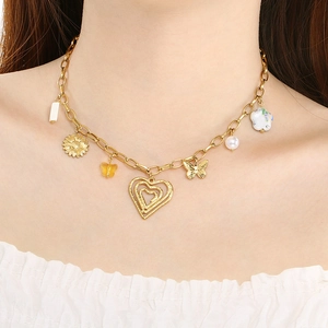 Gold multi-charm necklace with heart, butterfly, sunflower and pearl pendants
