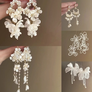 Elegant floral tassel earrings with pearls and crystals in a multi-angle display