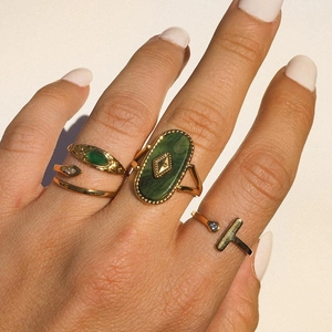 Minimalist gold snake ring and gemstone rings set with green stones for women