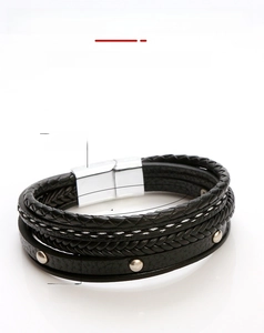 Detail of 21cm multilayer black braided leather bracelet with silver metal studs and clasp