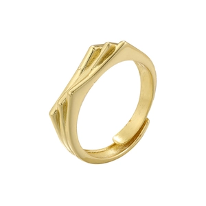 Macro detail of the gold-tone layered fan-shaped fold design on the open ring
