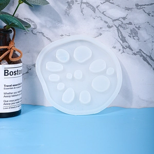 Macro detail of translucent 11-hole silicone mold for DIY lotus root pebble coasters