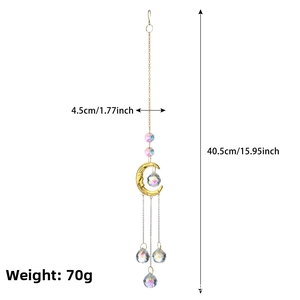 Detail of crystal moon suncatcher showing multi-faceted beads and golden crescent design