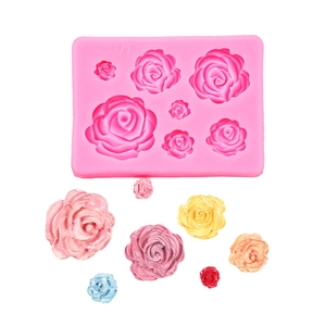 Detail of pink silicone mold with multi-size rose patterns and colorful resin flowers