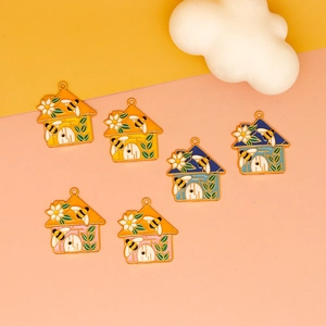 Detail of bee and house alloy pendants in colorful enamel for DIY jewelry making