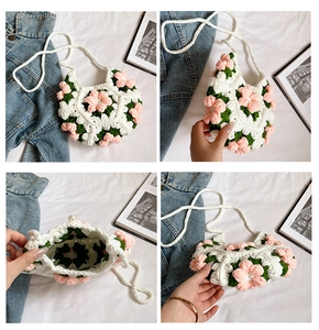 Detail view of handmade crochet flower bag with 3D floral accents and pearl clasp