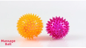 Detail of orange and purple massage balls with textured spikes for physical therapy