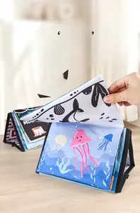 Close-up of soft ocean theme baby cloth books with built-in crinkle paper feature
