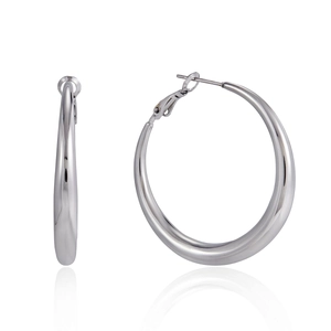 Macro detail of high-polish large silver hoop earrings featuring a thick minimalist design