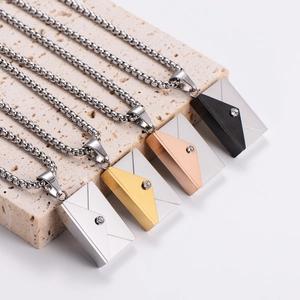 Polished envelope pendant necklaces in gold, silver, rose gold and black on stone base