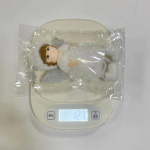 Detailed scale view of the 12.1g Christmas angel ornament in mesh dress