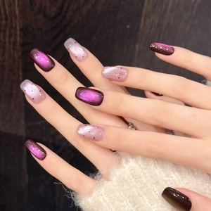 Purple cat eye and pink glitter press-on nails in medium square oval shape on hands
