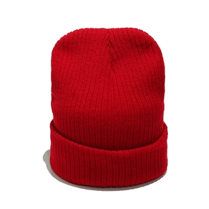 Classic red ribbed knit beanie with fold-over cuff for winter warmth and outdoor style