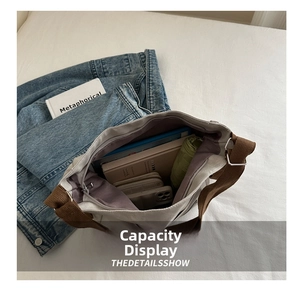 Interior view of off-white canvas tote showing capacity for books, wallet, and umbrella