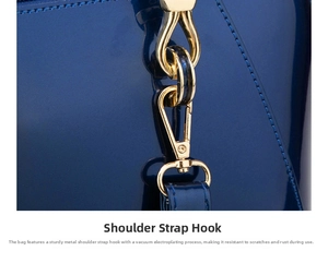 Detail of vacuum-plated gold shoulder strap hook on blue patent leather handbag