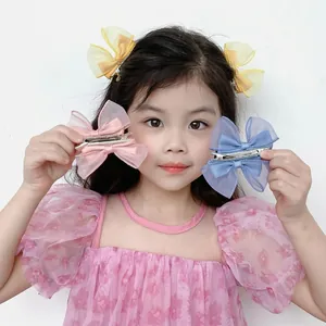 Three-color mesh butterfly bow hair clips for girls featuring layered tulle and satin ribbon