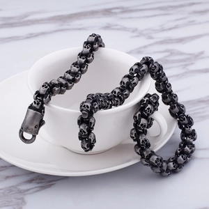 Detail of punk style skull chain bracelet with vintage finish and spring buckle