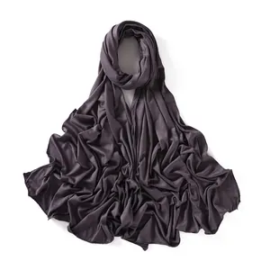 Detail of soft mercerized cotton jersey scarf showing flexible fabric and fine stitching