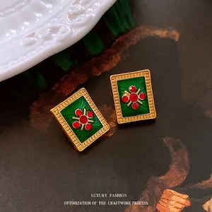 Vintage green enamel earrings with red zircon cross inlay and ornate gold bead edges