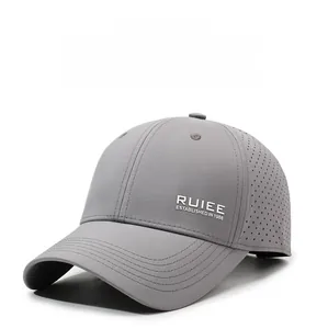 Detail view of grey quick-dry baseball cap with laser-cut breathability holes