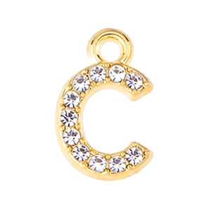 Macro shot of gold letter C pendant with sparkling rhinestones for jewelry making