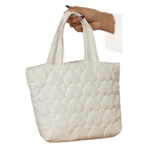 Cute cream-white quilted heart tote bag with soft padded handles for daily use