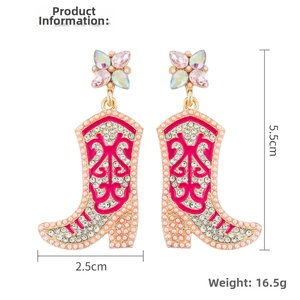 Detail of pink cowboy boot earrings with rhinestones and gold-tone bead trim