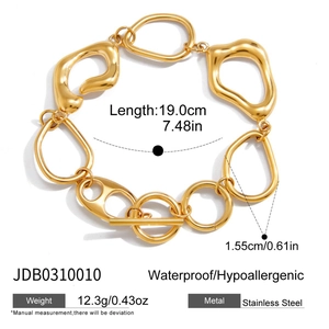 Macro detail of 18K gold stainless steel irregular hollow links and toggle OT clasp