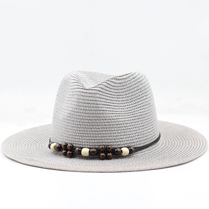 Neutral gray woven Panama hat with wooden bead band and flat brim for summer style