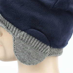 Winter men's thermal trapper hat with navy faux fur lining and grey knitted earflaps