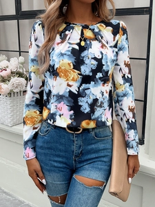 Detail of casual long sleeve top for women featuring vibrant floral print and round neck