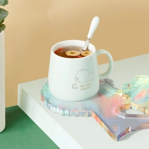 Iridescent laser acrylic tray with a ceramic bear mug in a minimalist lifestyle setting