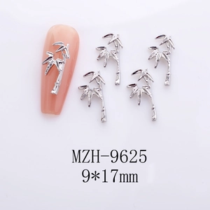 Detail view of a 9x17mm silver bamboo joint alloy nail charm on a pink manicure