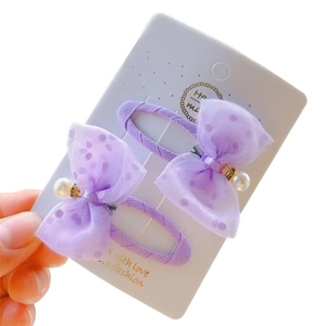 Set of two purple polka dot tulle bow hair clips with faux pearls and rhinestone charms