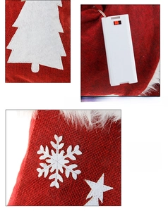 Detail of red burlap Christmas stocking with LED lights and internal battery compartment