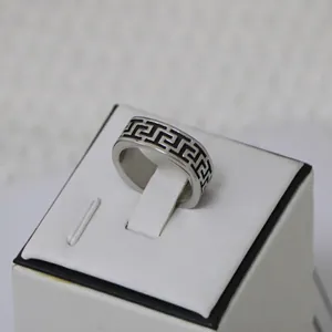 Polished titanium steel ring for men featuring a classic black Great Wall pattern design