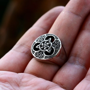 Macro shot of silver Viking Celtic knot ring with vintage oxidized finish for men