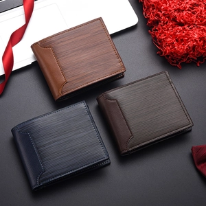 Flat lay of men's short wallets in brown, dark coffee and blue on decorative red background