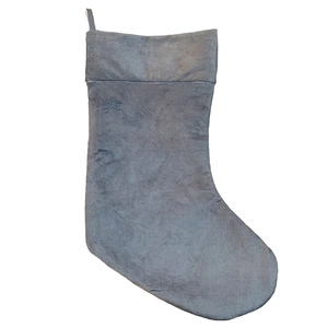 Macro view of plush dark gray Christmas stocking showing soft velvet texture details