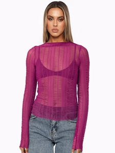 Detailed close-up of purple mesh fabric texture and striped pleated design on long sleeve top