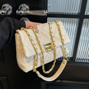 Elegant cream quilted crossbody bag with gold chain strap and square metal buckle