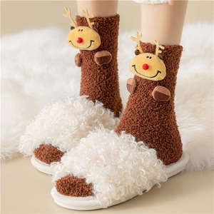 Plush Christmas coral fleece socks with 3D reindeer and white fuzzy slippers on rug