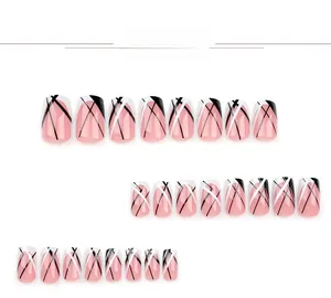 Detailed flat lay of 24 pieces of short square press-on nails with pink base and black-white lines