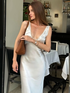 Elegant white satin slip dress with deep V lace trim and slim fit silhouette