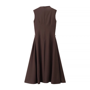 Detail view of deep brown sleeveless maxi dress featuring back zipper and side metal ring accents