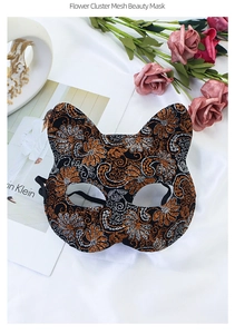 Detail of Flower Cluster Mesh Beauty Mask with orange and silver glitter patterns