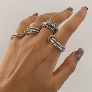 Stacked titanium steel rings set with pearls and crystals in gold and silver finish