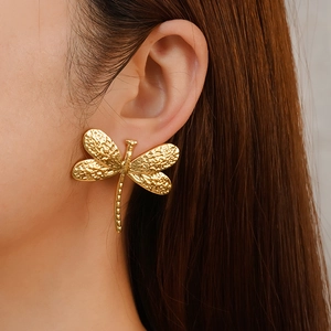 Vintage golden dragonfly earrings for women with textured metal finish in a stylish look