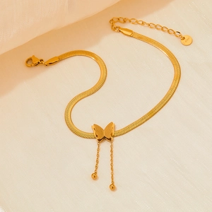 Golden stainless steel butterfly tassel anklet with snake chain on soft fabric